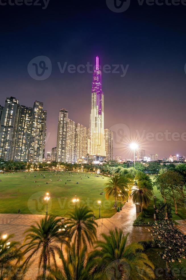 Beautiful night view with colorful sky at Landmark 81 - it is a super tall skyscraper with development buildings along Saigon river in Ho Chi Minh city, Vietnam. photo