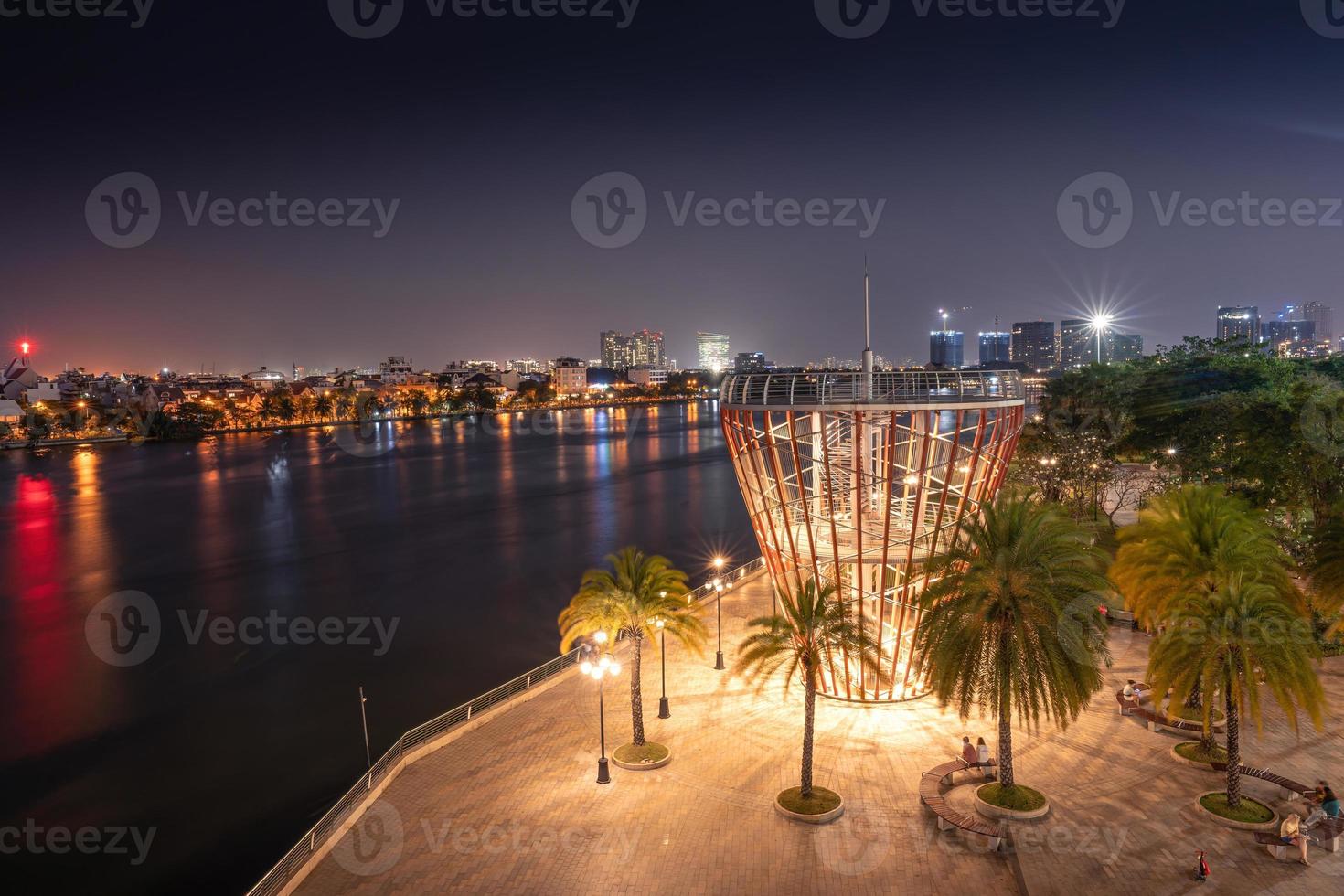 Beautiful night view with colorful sky at Landmark 81 - it is a super tall skyscraper with development buildings along Saigon river in Ho Chi Minh city, Vietnam. photo