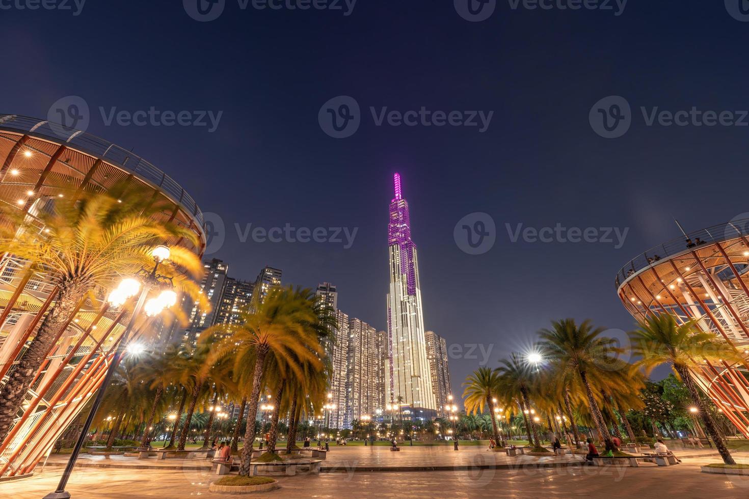 Beautiful night view with colorful sky at Landmark 81 - it is a super tall skyscraper with development buildings along Saigon river in Ho Chi Minh city, Vietnam. photo