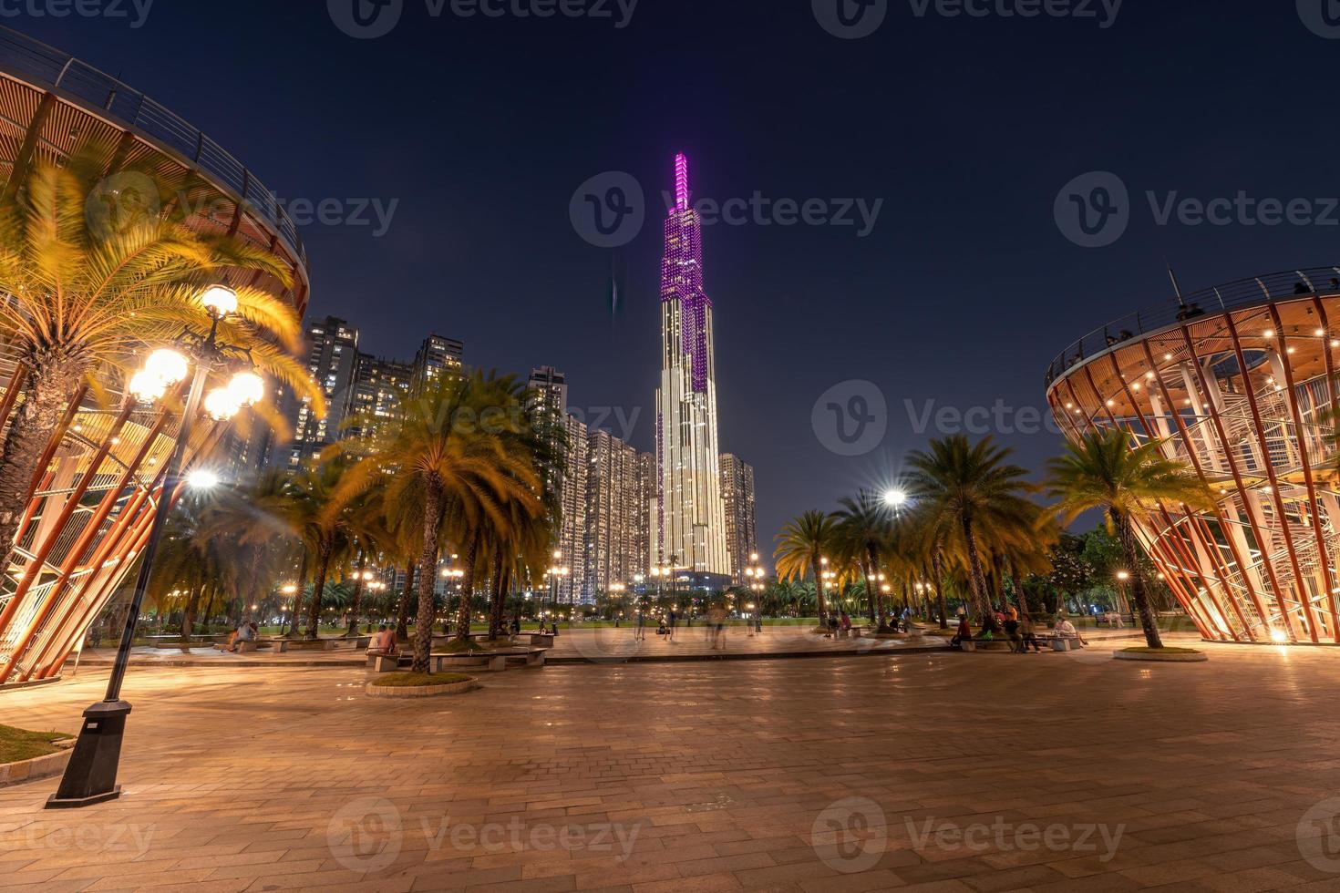 Beautiful night view with colorful sky at Landmark 81 - it is a super tall skyscraper with development buildings along Saigon river in Ho Chi Minh city, Vietnam. photo