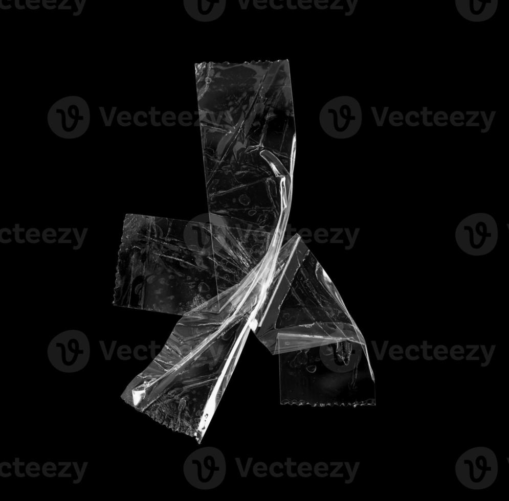 adhesive plastic tape isolated on black background photo