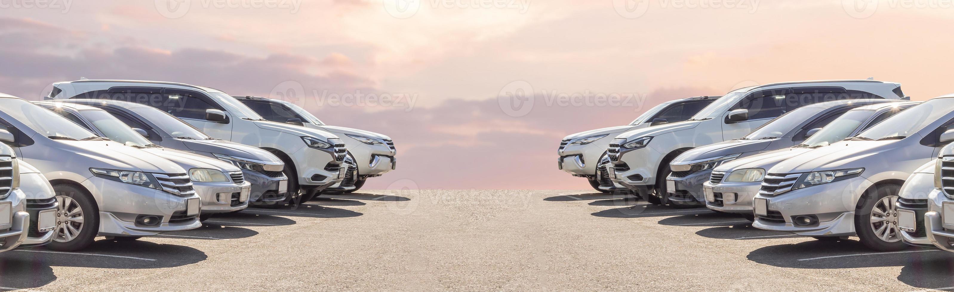 Lot of used car for sales in stock with sky and clouds photo