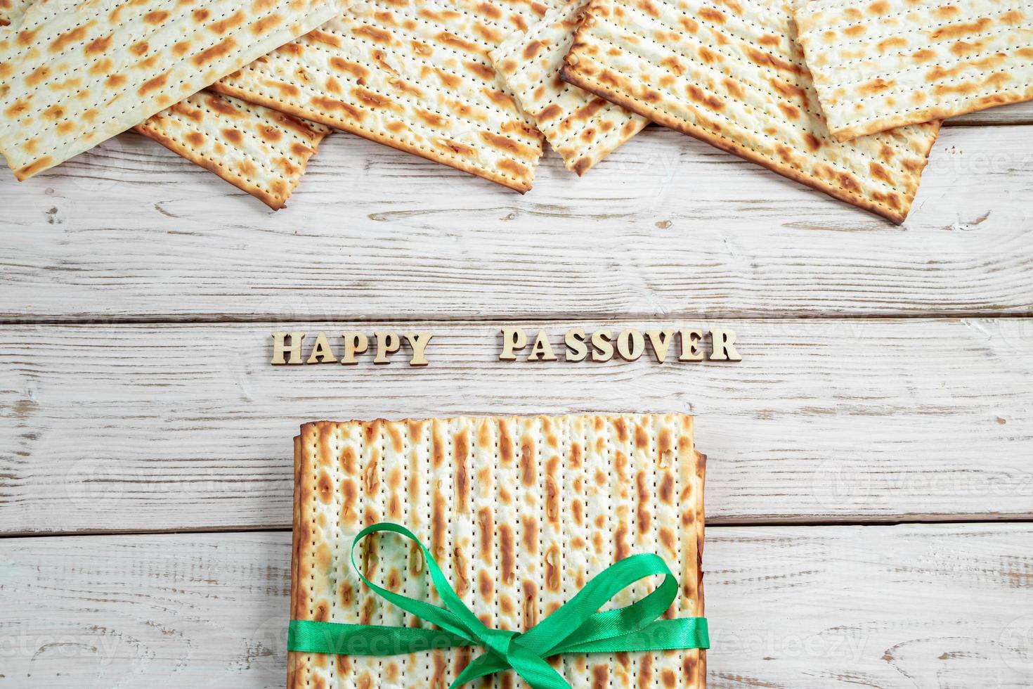 Concept of Jewish holiday Pesach. Passover. Traditional matzah on a white wooden background. Matzo bread. photo