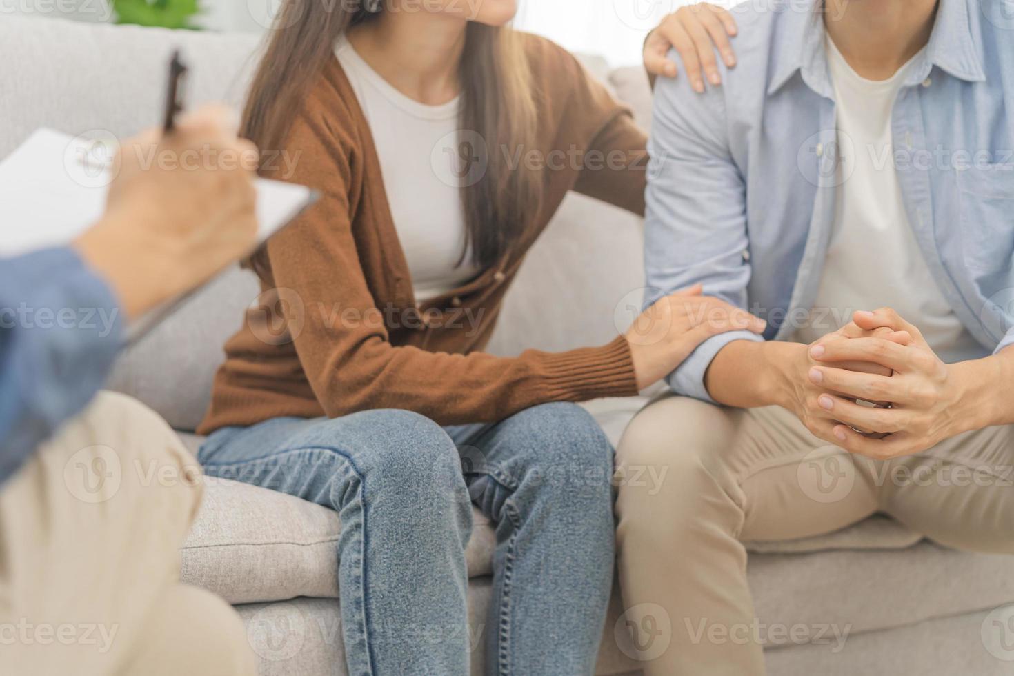 Psychology, depression asian young couple love, woman, man patient consulting problem mental health with psychologist, psychiatrist at clinic together, wife encouraging husband,  therapy health care. photo