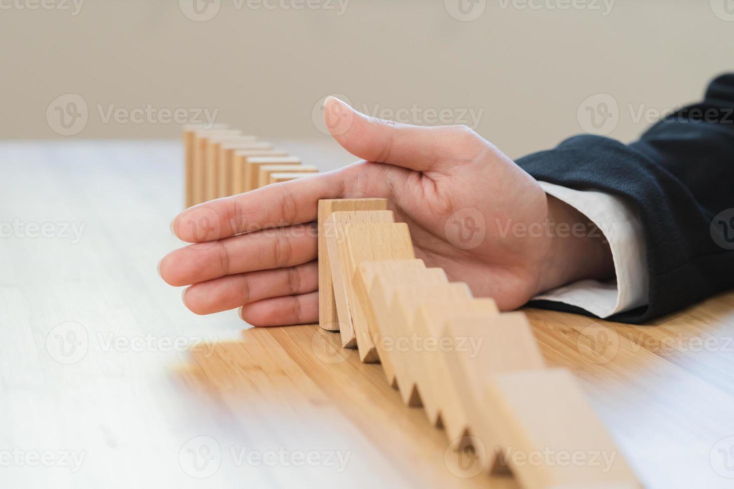Protection finance, stopping falling block effect collapse domino wooden, Recovery risk business, Management strategy and planning before destroy. Successful intervention. photo