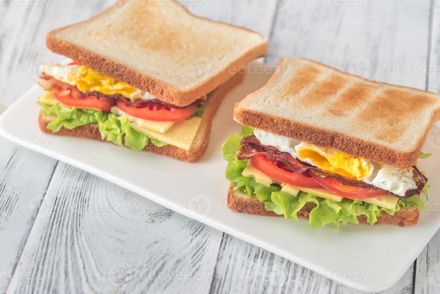 Sandwiches with fried egg and bacon photo