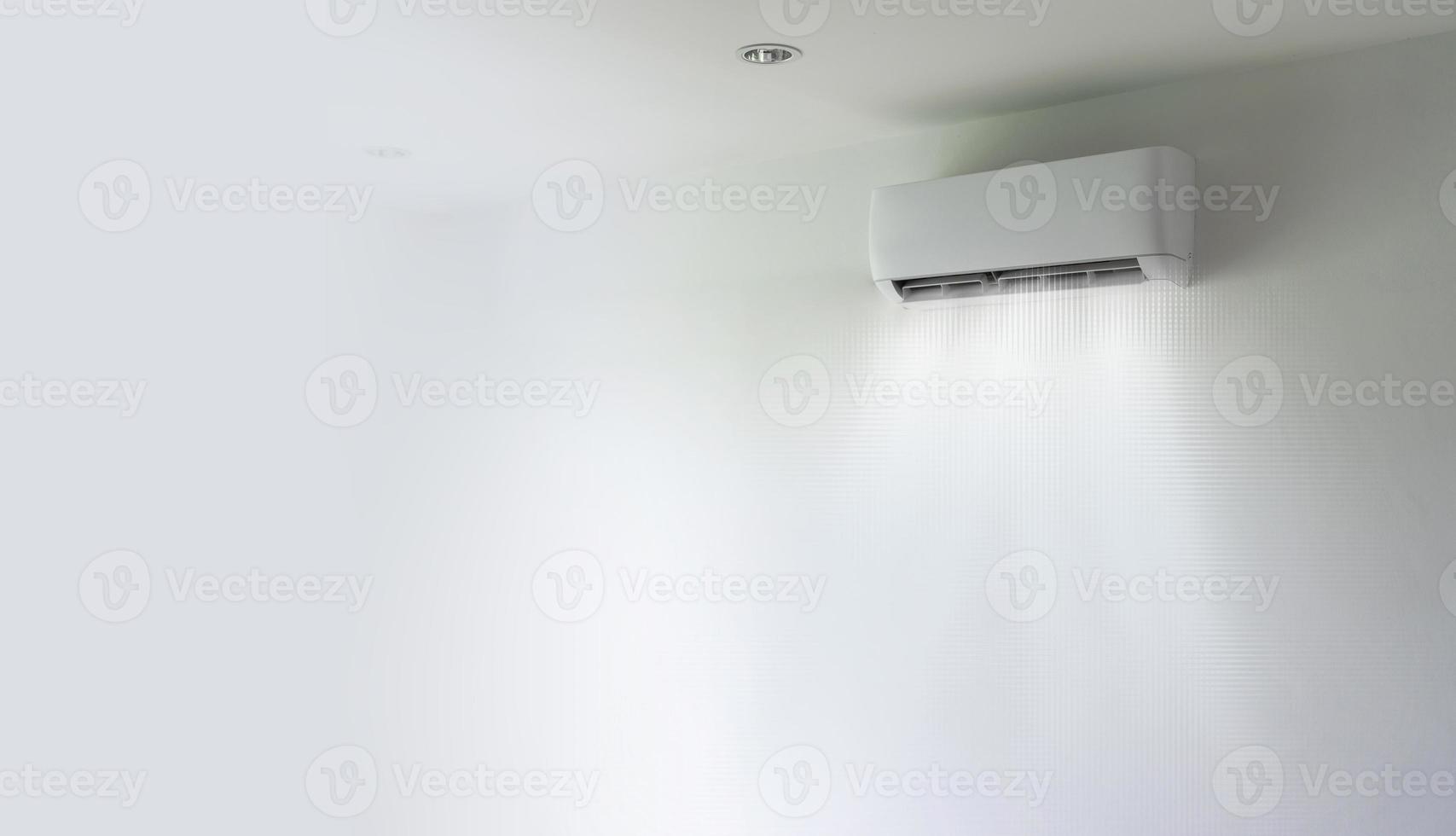 Air conditioner and wind flow on wall background photo