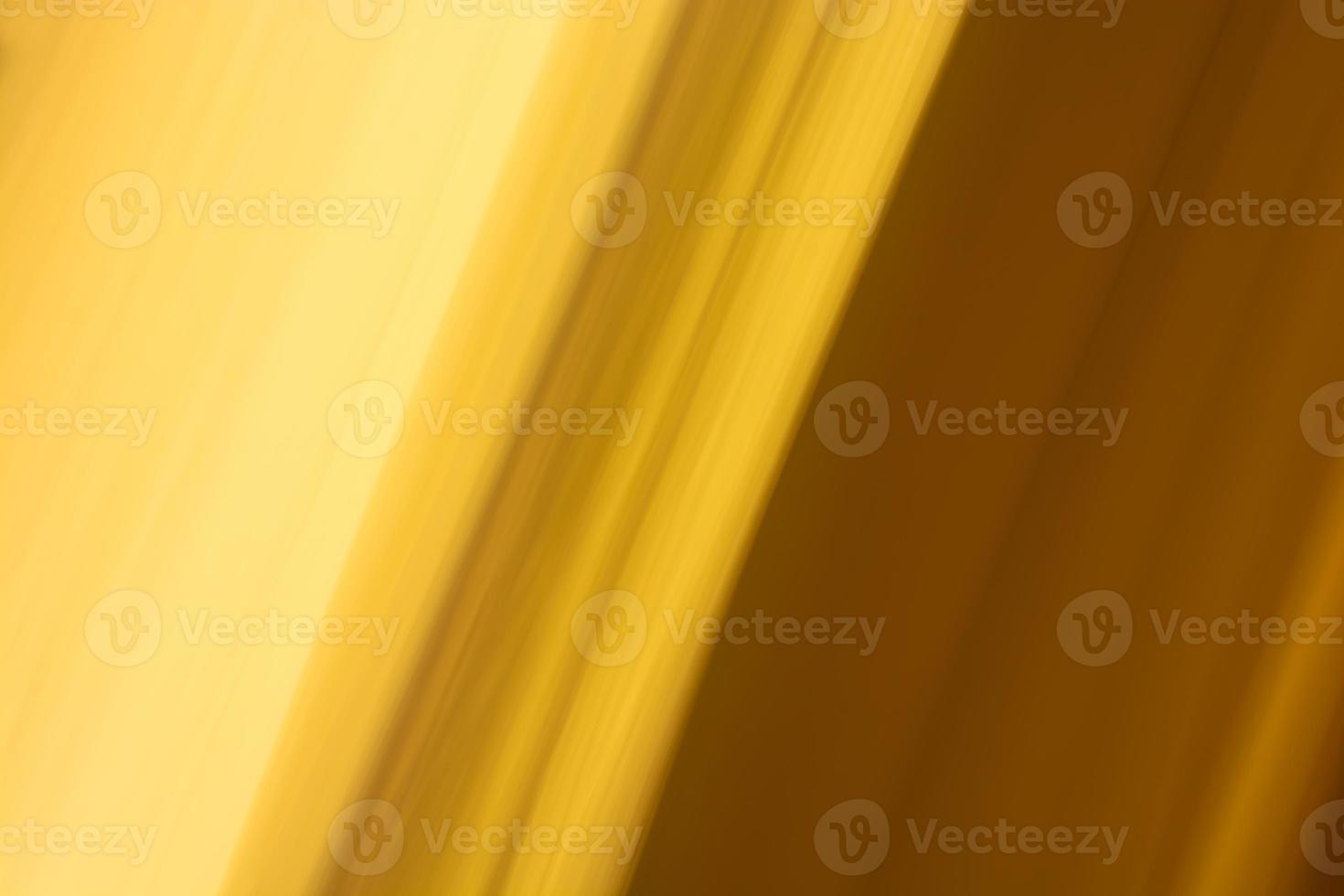 Abstract yellow background. Blurred golden tone. photo