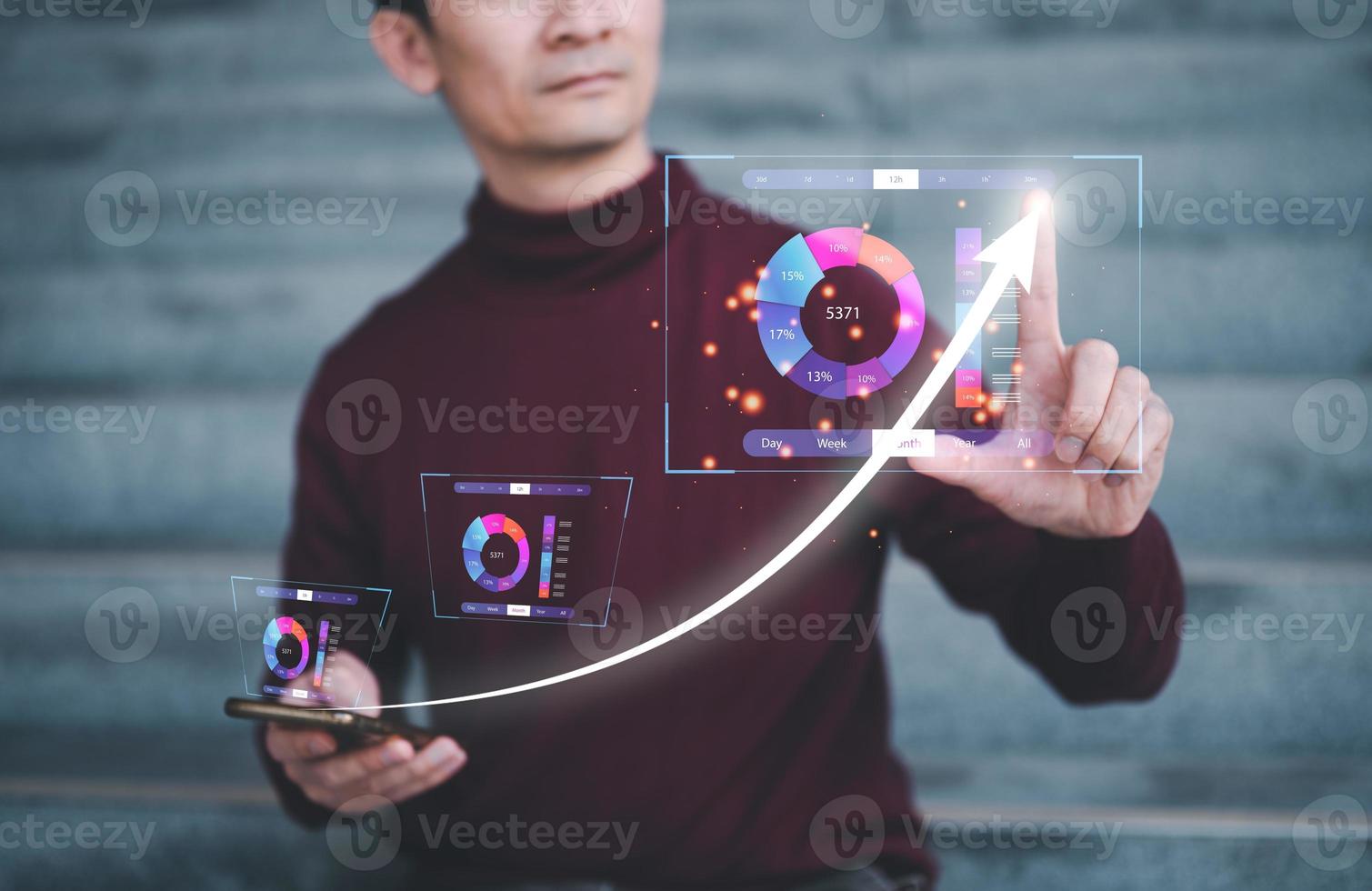 business planning and strategy concept, man sitting outside analysing data charts and arrow up show profits sale increasing to target photo