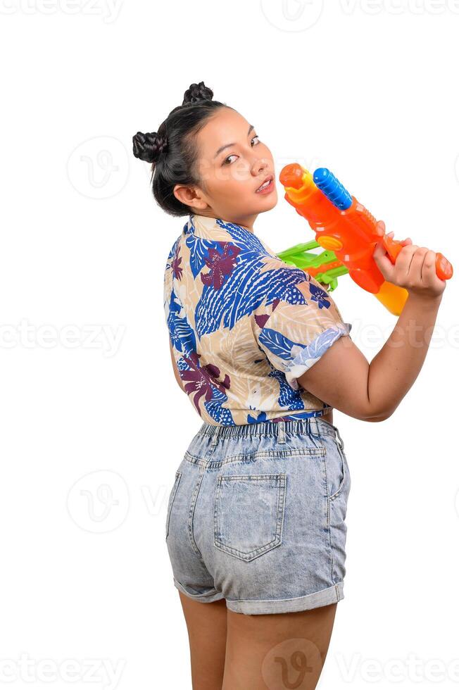 Portrait smiley woman in Songkran festival with water gun photo