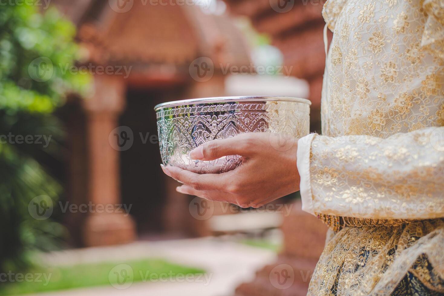 Female holding water bowl on Songkran festival photo