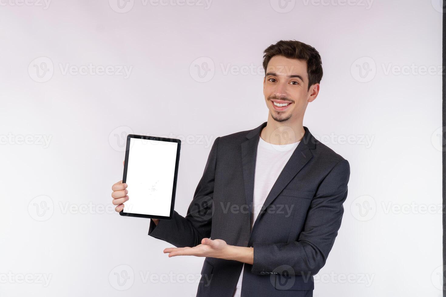 Portrait of attractive cheerful businessman using device app searching web isolated over white color background photo