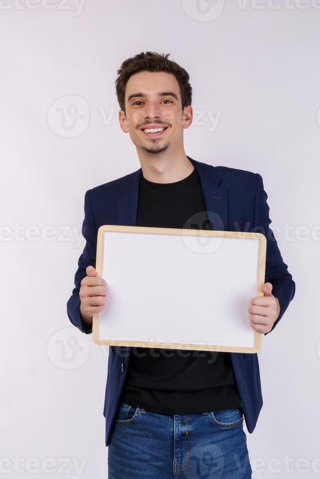 Portrait of happy businessman showing blank signboard on isolated white background photo