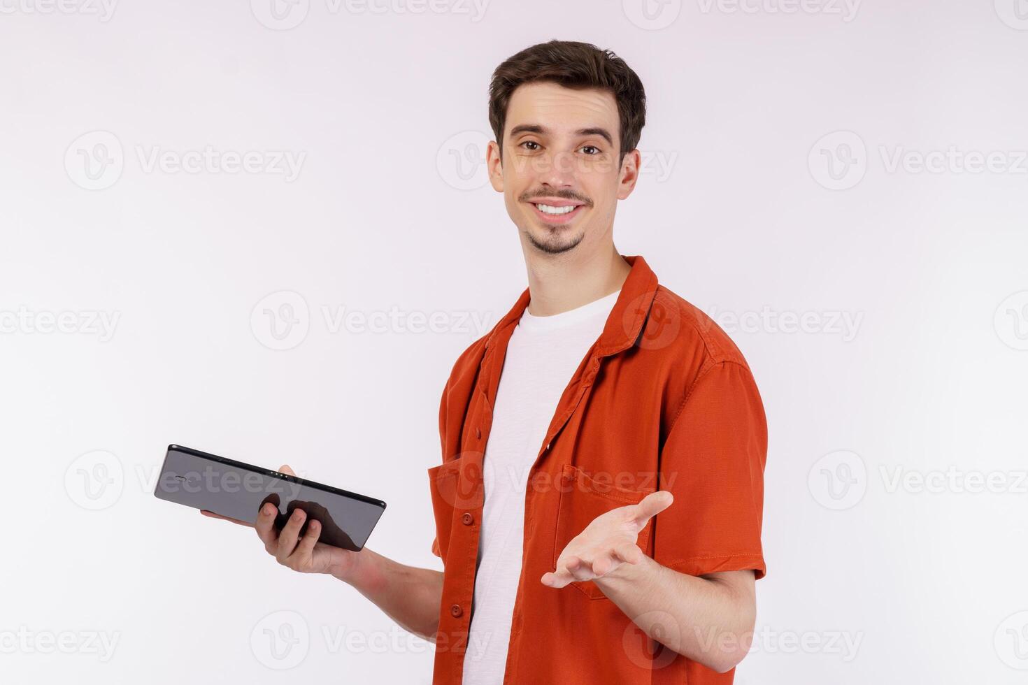Portrait of attractive cheerful man using device app searching web isolated over white color background photo