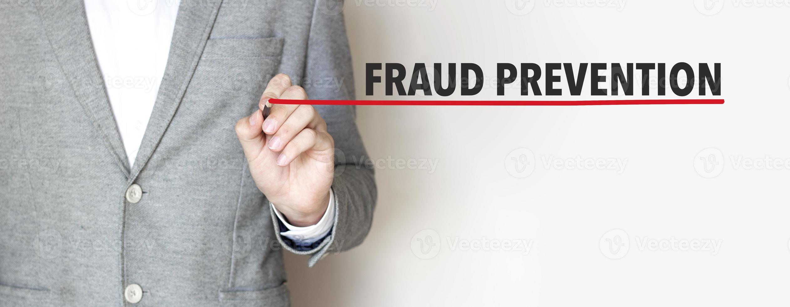 fraud prevention words made with marker and businessman photo