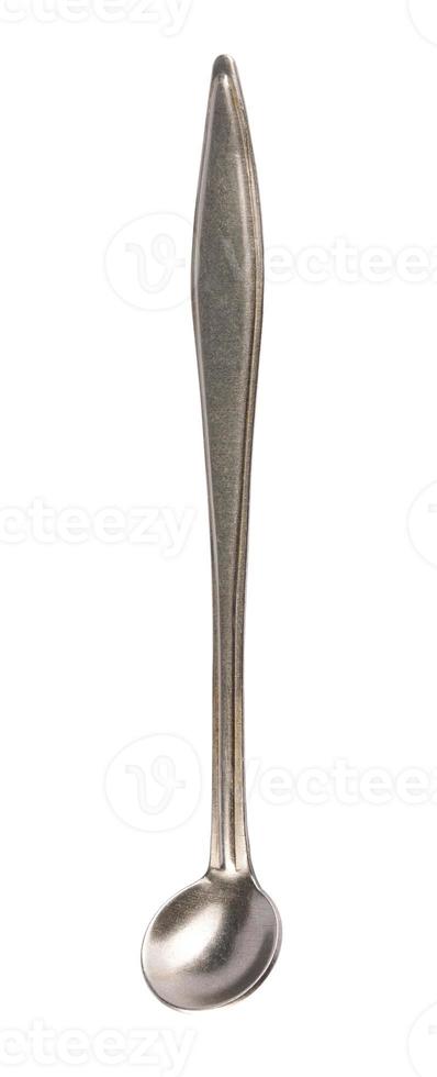 Small antique metal spoon isolated on white background. photo