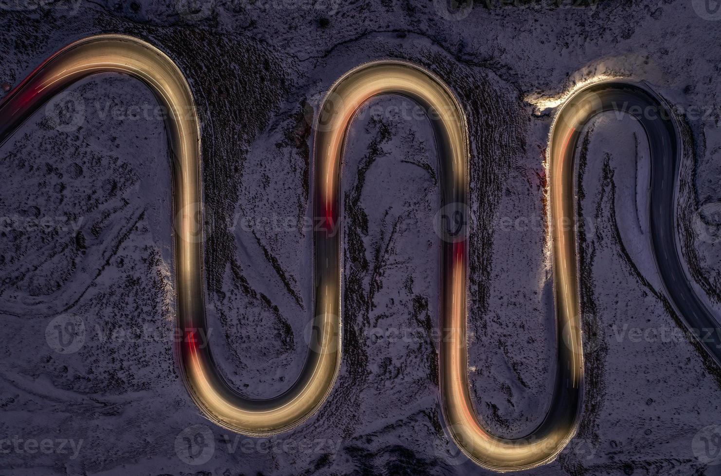 A snake shaped pass road photographed at night.light painting photo