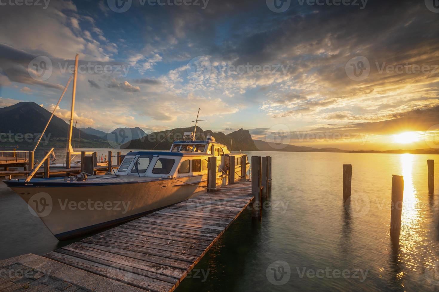 A lake and a jetty on the side a boat photo