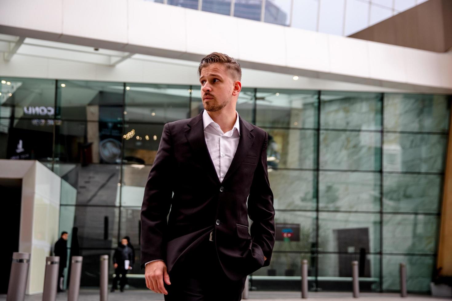 portrait of a young businessman goes to work in a business center photo