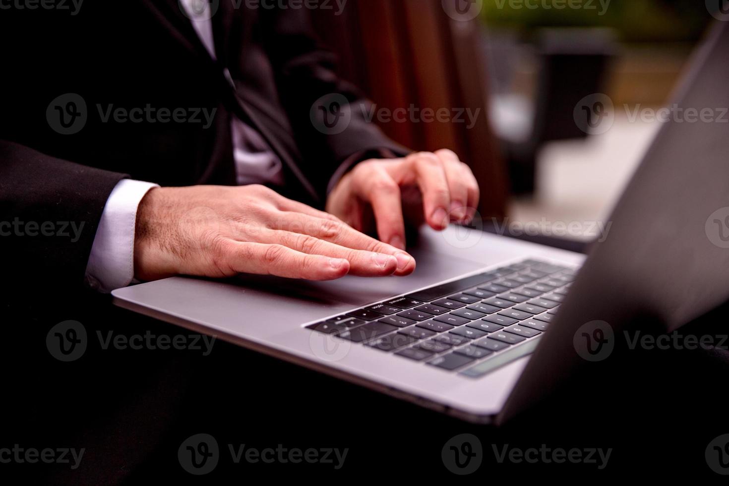 working on a computer hands close up photo