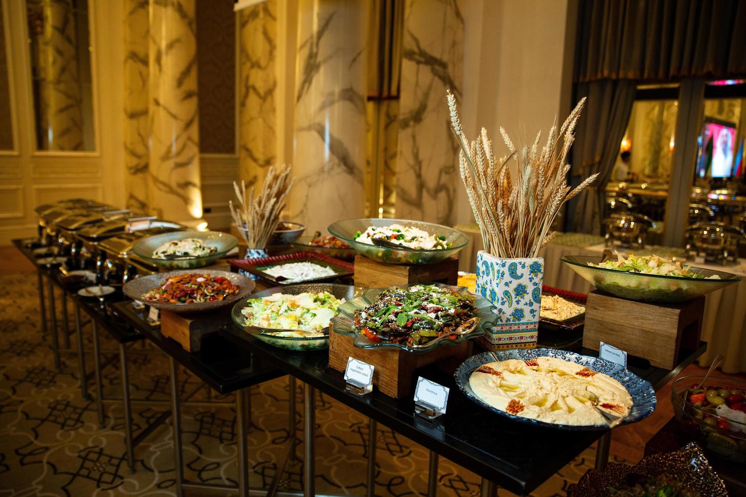 buffet table with various salads and snacks photo