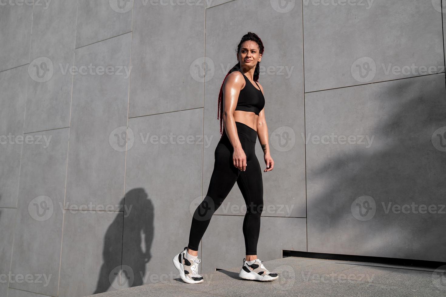 Fitness portrait, exercise and happy woman at gym for a workout, training and body motivation at health club. Face of sports or athlete female happy about performance, progress and healthy lifestyle photo