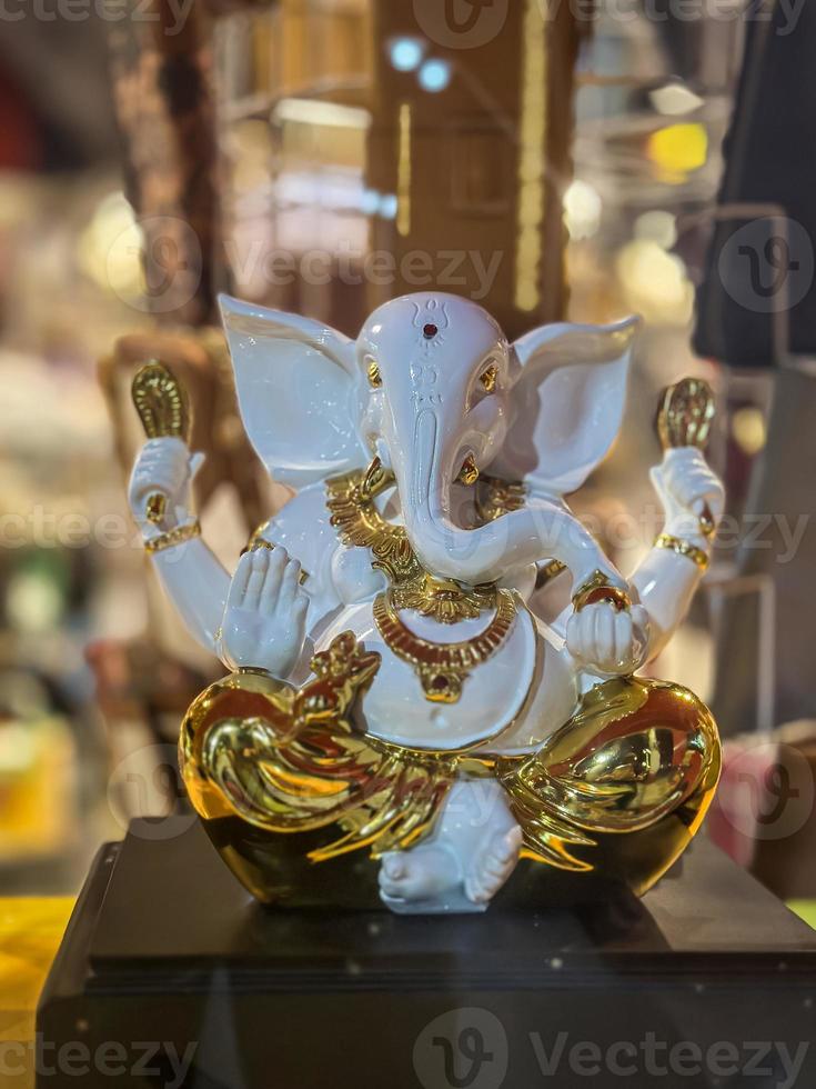 Statue of lord Ganesha white and gold colour photo