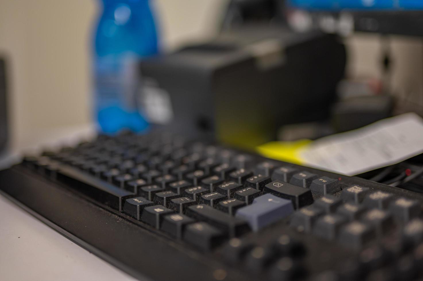 black keyboard with small aperture in work place photo