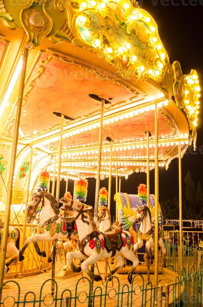 merry-go-round at fairground at night photo