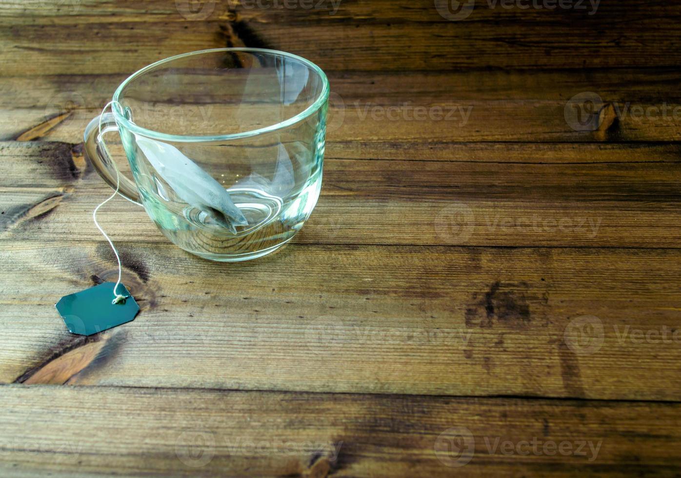 Glass mug with tea bag. photo