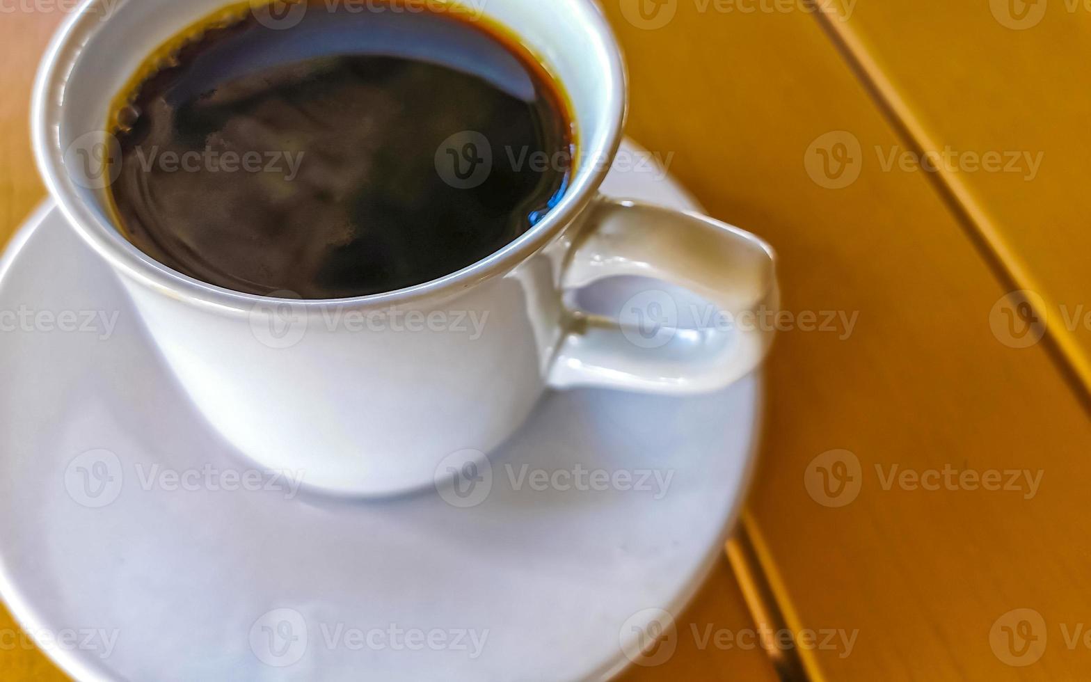 Cup of americano black coffee in restaurant Mexico. photo