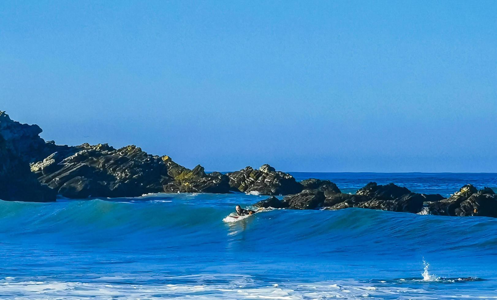 Puerto Escondido Oaxaca Mexico 2023 Surfer surfing on surfboard on high waves in Puerto Escondido Mexico. photo