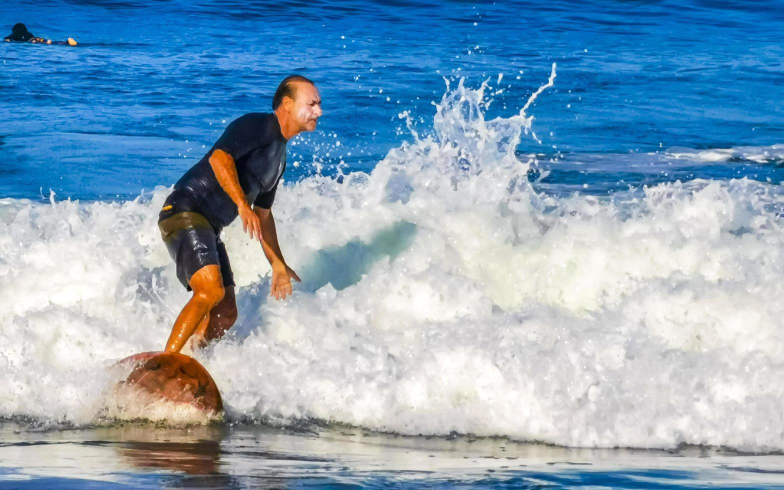 Puerto Escondido Oaxaca Mexico 2023 Surfer surfing on surfboard on high waves in Puerto Escondido Mexico. photo