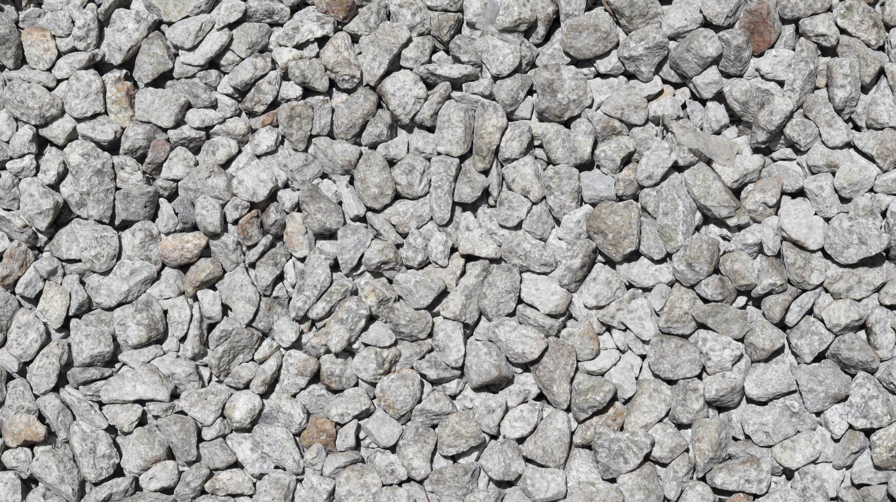 Crushed stone aggregate texture background and backdrop material design. photo