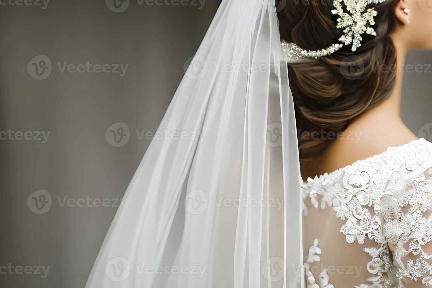 Close up detail a bride from behind in a white wedding dress. photo