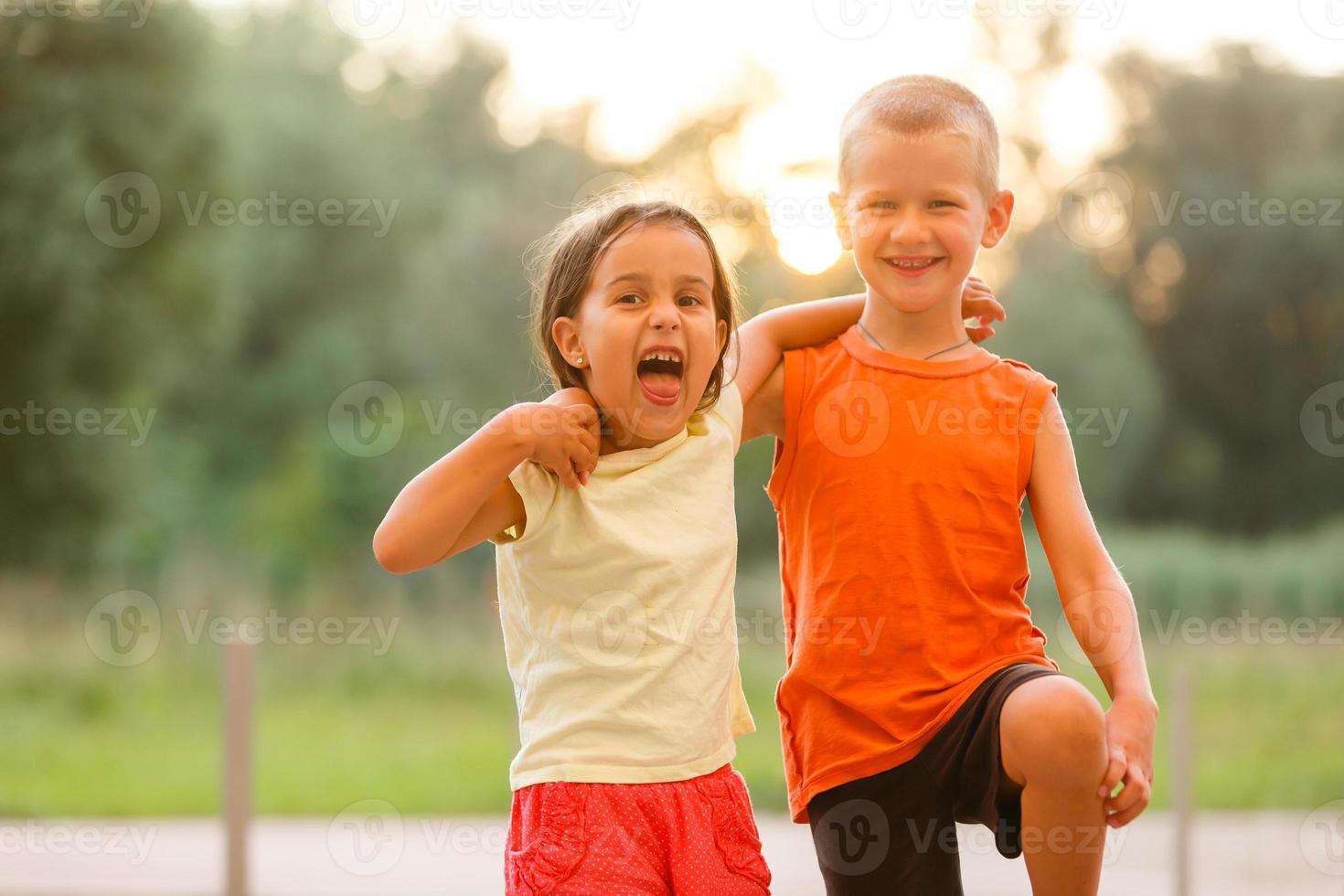 Portrait Of Children With Friends On Hiking Adventure In Woods photo