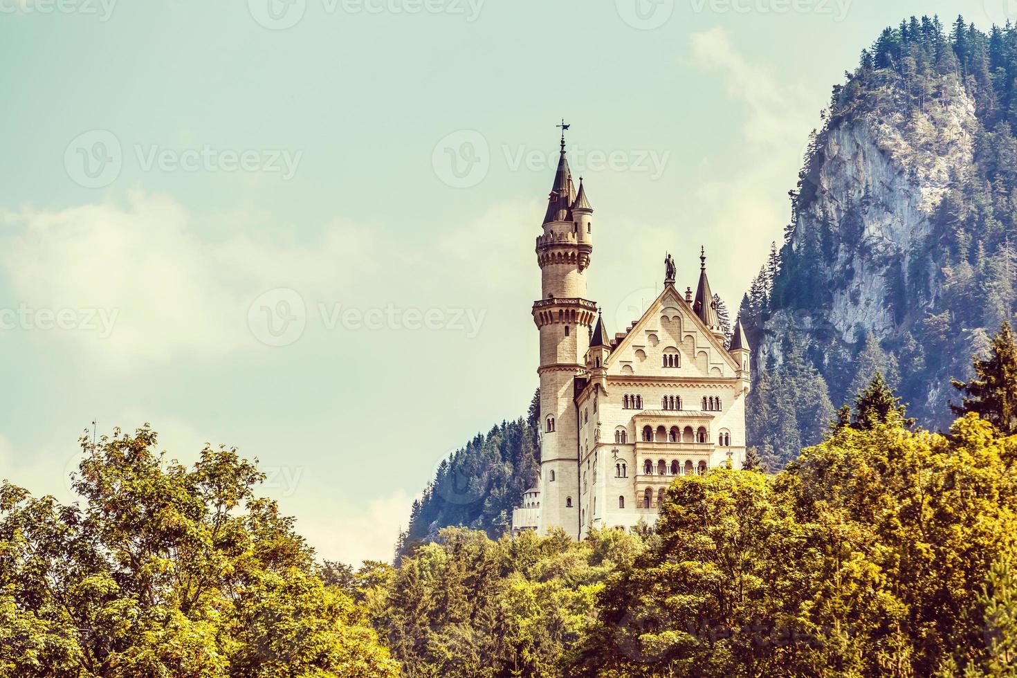 Beautiful view of world-famous Neuschwanstein Castle, the nineteenth-century Romanesque Revival palace built for King Ludwig II on a rugged cliff near Fussen, southwest Bavaria, Germany photo