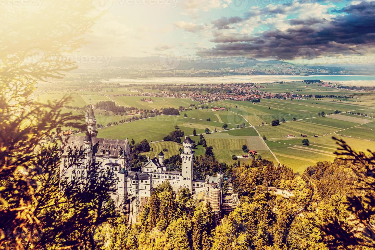 Beautiful aerial view of Neuschwanstein castle in autumn season. Palace situated in Bavaria, Germany. Neuschwanstein castle one of the most popular palace and travel destination in Europe and world. photo