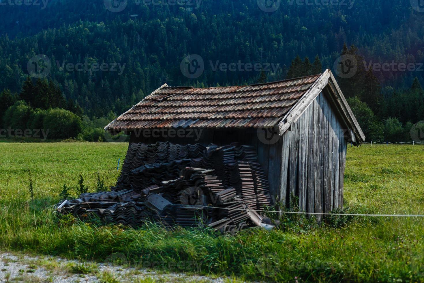 One wooden house in the fall on a hill in the mountains. photo