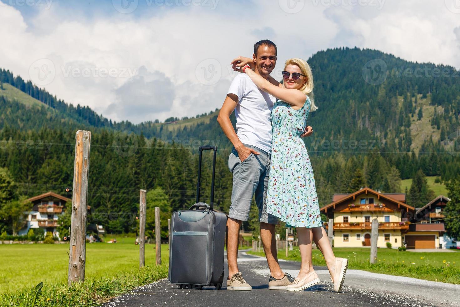 Happy smiling couple in love in the mountains photo