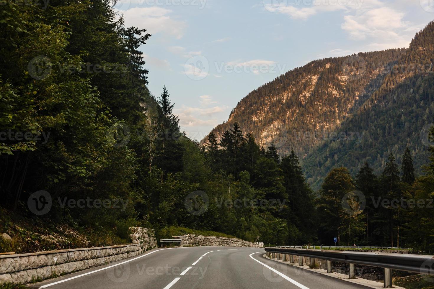 Road turning in the mountains, Alps background photo