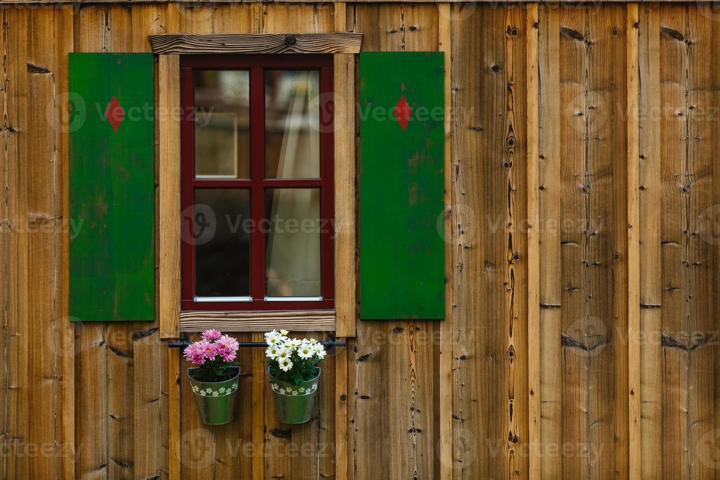 beautiful old villa with hanging plants from the balcony, photo