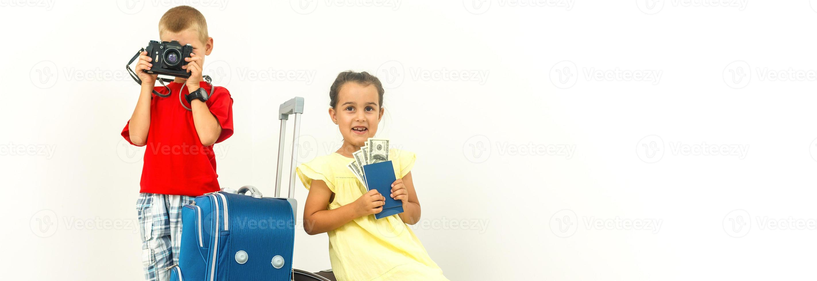 Adorable kids brther and sisterwith a suitcase sitting while travelling copyspace family kids children vacation trip geography childhood responsible memories enjoyment photo