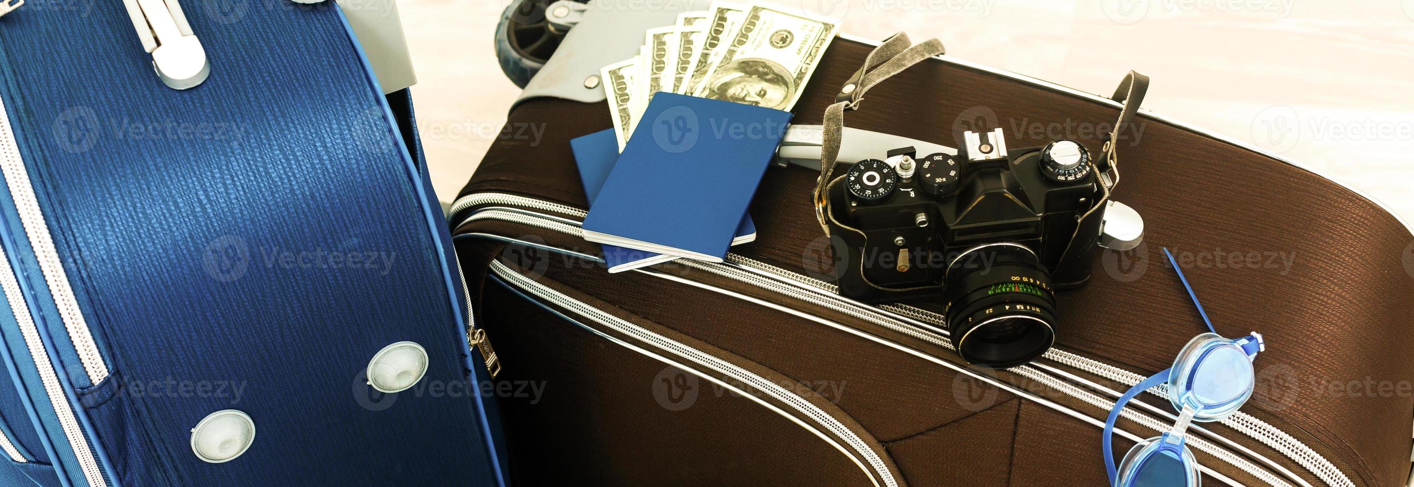 Different suitcases on tile floor photo