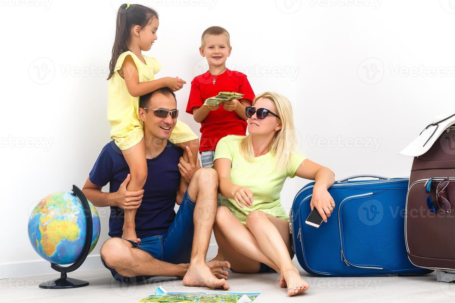 Happy family with luggage are ready to travel. Isolated on white
