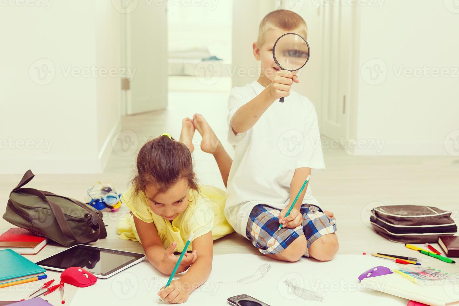 A little cute girl in a yellow dress on the floor photo