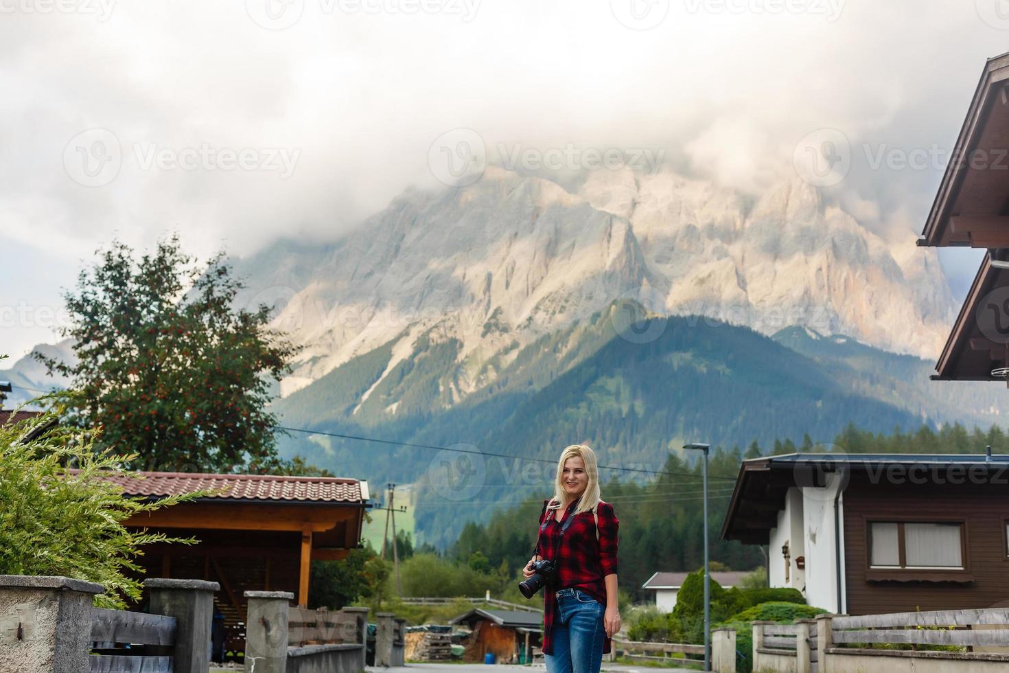 A woman looking at the mountains. Europe, Germany, Bavaria photo