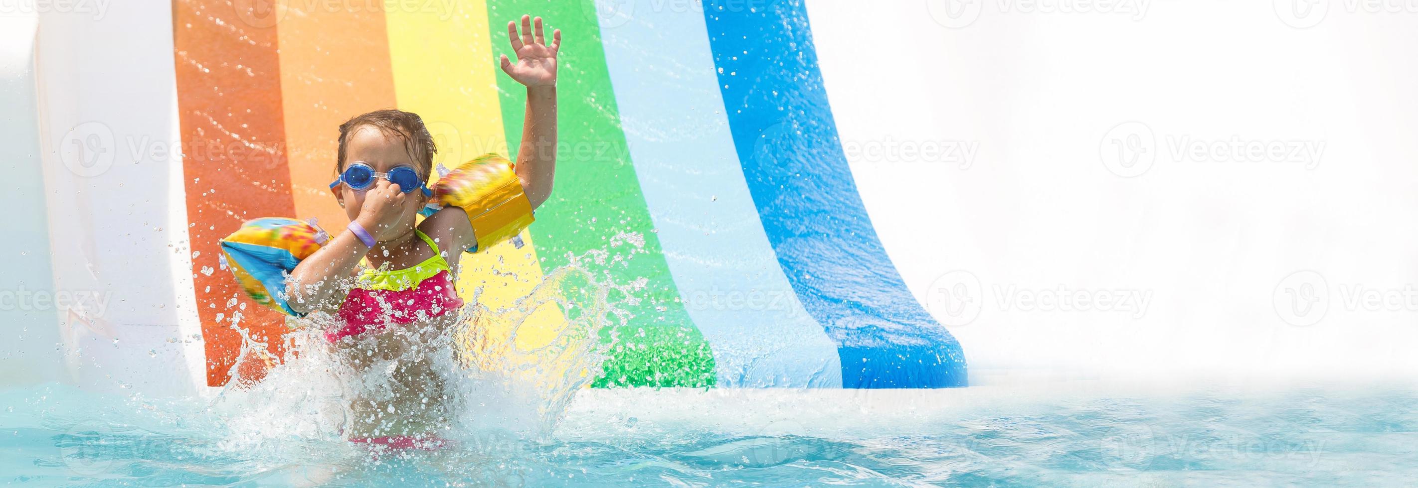 A girl playing in a summer swimming pool photo