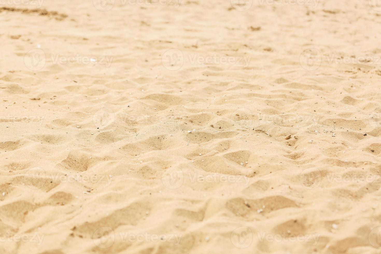 closeup of sand pattern of a beach in the summer photo