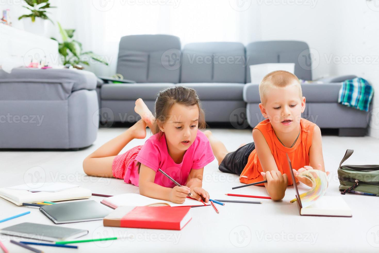 Covid-19 Coronavirus and Learning from home, Home school kid concept. Little children study online learning from home with laptop. Quarantine and Social distancing concept. photo